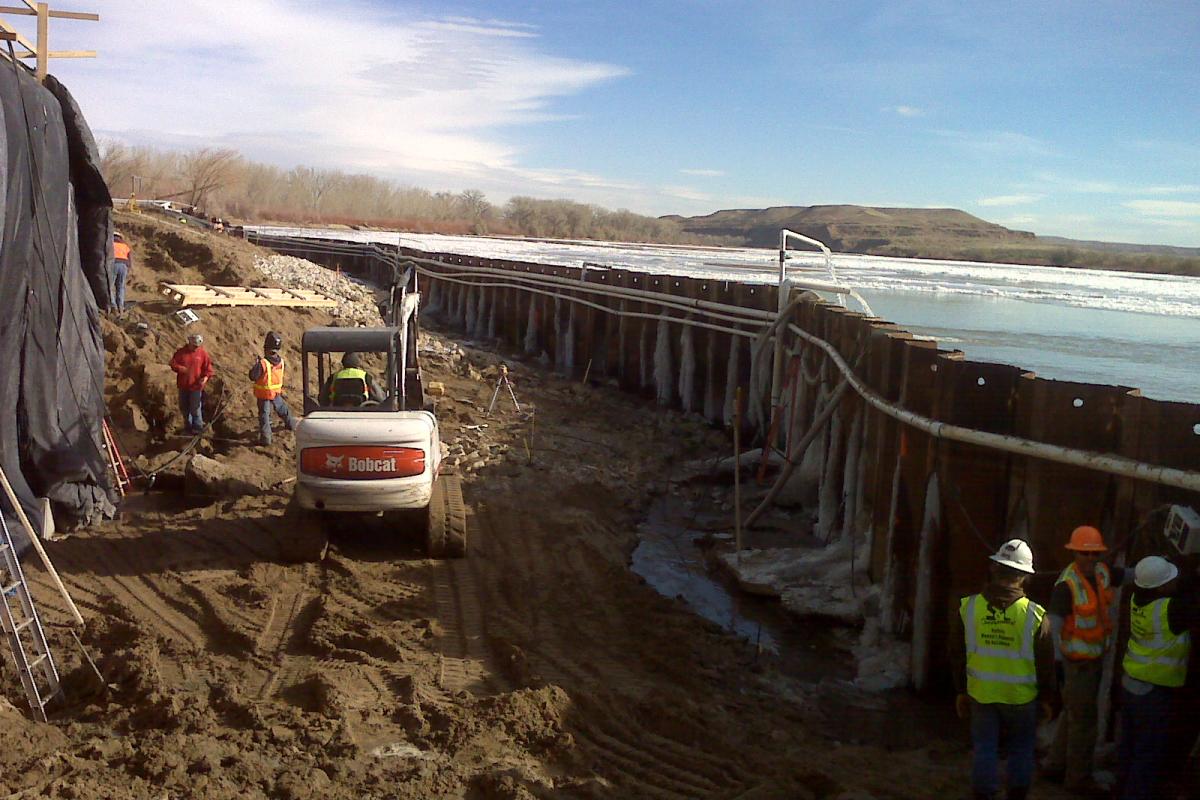 Sheet pilings hold back the Green River as construction progresses