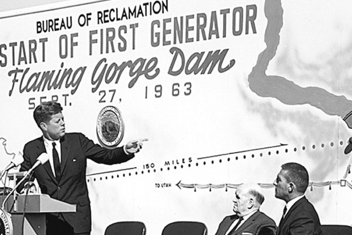 President John F. Kennedy, from a ceremony held at the Salt Lake City Airport, starts the first generator in Flaming Gorge Dam