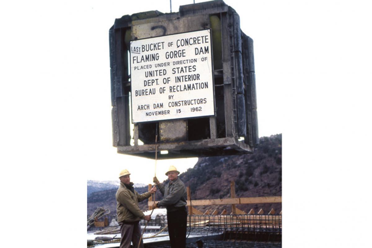 The last bucket of concrete is poured at Flaming Gorge Dam – November 15, 1962